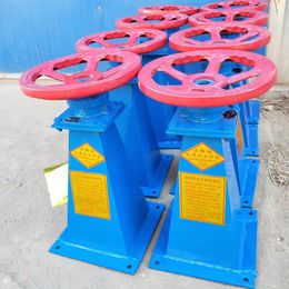 The manufacturer provides a hand wheel hoist, a hand operated side swing hand electric dual purpose screw hoist, and an integrated gate