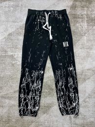 black sweatpants men's sweatpants baggy sweatpants encased elastic waistband and drawstring zippers pockets letter decoration thick casual trousers Hip-hop