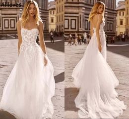 Sexy Boho A Line Wedding Dresses Spaghetti Straps Lace Appliqued Tulle Beach Bridal Gowns Sweep Train Backless Plus Size Reception Dress Robes de Mariee CL1085