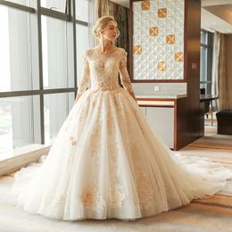 Arabic Gorgeous Ball Gown Wedding Dresses Champagne Lace Appliques Scoop Neck 3/4 Long Sleeves Sweep Train Puffy Tulle Open Back Bridal Gowns