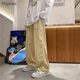 Calça masculina calças casuais homens bolsos sólidos projetar adolescentes de moda all-party harajuku botes simples empeta solta empire primavera nova t220909