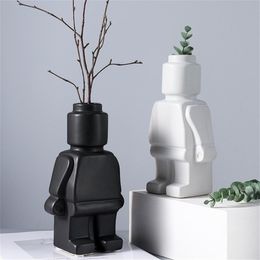 vases for table decorations Canada - Artificial Flower Vase Home Room Decor Table Decoration Ceramic Whiteware Ornaments Robot Sculpt Figurines Europe Modern Style 2111032290