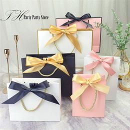 Gift Wrap 10Pcs/Lot White Black Bow High Quality Simple Gift Bag Kraft Paper Candy Box With Handle Wedding Birthday Party Gift Bag 220913
