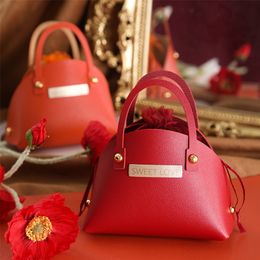 leather handbag wholesale Canada - Gift Wrap Luxury Creative Leather Handbag Candy Bag For Wedding Christmas Party Jewelry Packaging Baby Shower Cute Bag 220913
