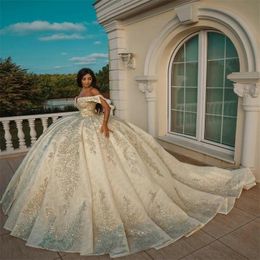 2022 Luxury Ball Gown Wedding Gowns Puffy Illusion Off Shoulder Dubai Arabia Sequined Plus Size Lace Appliques Crystal Beads Bridal Party Dresses Robe De Marriage