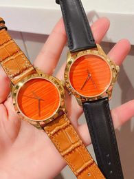 Luxury Couples Quartz Wristwatch Women Sapphire Crystal Glass Watch Men Genuine Leather Animal Watches Female Male Orange Dial Geometric Clock 38mm