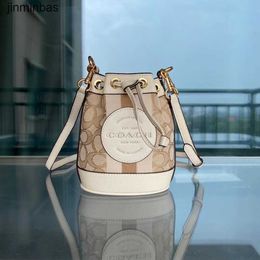 50% Discount in Stores 2023 Fashion Bag New Mini Bucket Bag Dempy Large Round Label Women's Drawstring One Shoulder Handheld Crossbody