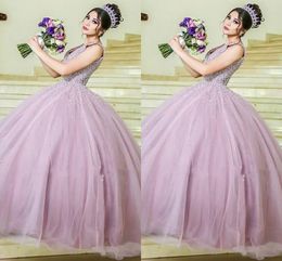 2023 Modest Blush Pink Wedding Dresses Birdal Ball Gowns Beaded Pearls Plunging V-neck Open Back Party Dress For Bride Tulle