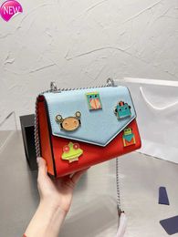 Women's Designer Bags 22 New Cartoon Robot Color Matching Chain Postman Single Shoulder Messenger Bag p Badge Letter Leisure Small Square Bag Factory Direct Sales