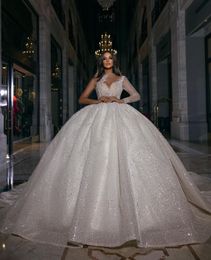 Luxury Ball Gown Wedding Dresses Deep V Neck One Long Sleeve Halter Beads Appliques Sequins 3D Lace Ruffles Celebrity Sparkly Plus Size Bridal Gowns Custom Made