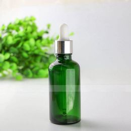 Wholesale e liquid empty glass dropper bottles 50ml green cosmetic bottles with 7 Style caps for choice