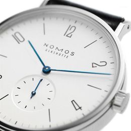 Нарученные часы целые женщины смотрят бренд nomos Мужчины и минималистский дизайн