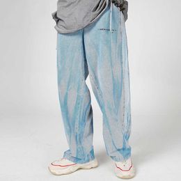 Jeans da uomo Pantaloni causali Hip Hop Jean Uomo Harajuku Tie Dye Stampa Pantaloni larghi in denim Moda Pantaloni larghi Azzurro Autunno Streetwear Uomo T221102