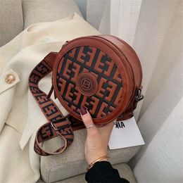 New fashion small round bag new wide shoulder strap cross carrying one leisure Women's backpack indentation letter