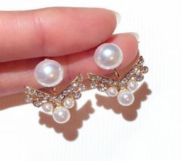 Fashion Diamond Pearl Dual Uso Pendientes Diseñador único Elegante elegante Pendientes de tachuelas para mujer Regalos con Box7355871