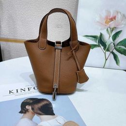 Sell designer bags on the cheap 2023 new head leather Togo Mini Leather bucket 14cm lock vegetable basket