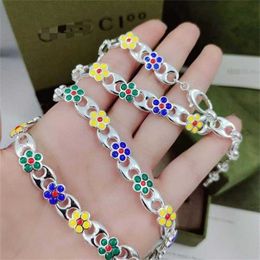 10% OFF 2023 Jewellery Double Interlocking Flower Necklace Female Family Colourful Enamel Pig Nose Bracelet Hollow out Ring Fashion