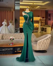 Sexy Mermaid Prom Dresses for Women Plus Size Dark Green Crystal Beads One Shoulder Long Sleeve Side Split Satin Floor Length Special Occasion Evening Party Gowns