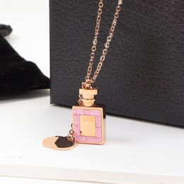 Fashion Women Designer Earrings Necklace Titanium Steel Luxury Style Pink Diamonds Perfume Bottle Love Pendant Jewelry Wholesale