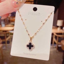 Pendant Necklaces 2021 autumn new micro inlaid double-sided four leaf flower titanium steel necklace Female Minority design temperament and versatile