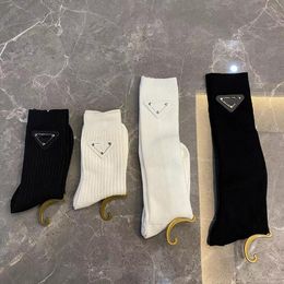 Luxury Designer Pra Socks For Women Handmade Leather Iron Triangle Black White Middle Tube Stockings Female Cotton Sock