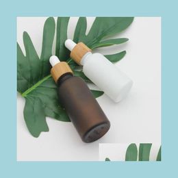 Packing Bottles Frosted Amber White Glass Dropper Bottle 15Ml 30Ml 50Ml With Bamboo Cap 1Oz Wooden Essential Oil Bottles Drop Deliver Dhvjt