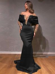 Charming Black Mermaid Evening Dresses 2023 Illusion Long Sleeve Satin Prom Party Gown Gold Appliques Beaded Sexy Transparent V-Neck Women Special Occasion Wear