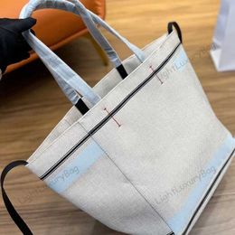 5A Beach Bag Designer Leather canvas patchwork Shoulder High capacity Versatile handbags For Women Classic Famous Brand Shopping Purses220214