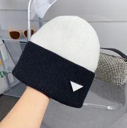 Quality triangle label knit hat women's new winter decoration black and white mixed color warm wool knit cap cycling ear mask cold hats