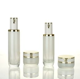 Luxury Transparent Glass Lotion Pump Bottles Cosmetic Cream Jars with white gold lids for toner serum essential oil