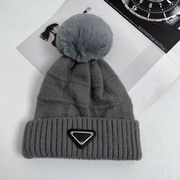 European and American hair ball hat women's wool knitted warm flanged autumn and winter fashion triangle label hats