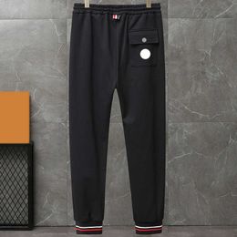 Модельер -дизайнер мужские брюки вышитые значки пары теплые грузовые брюки.