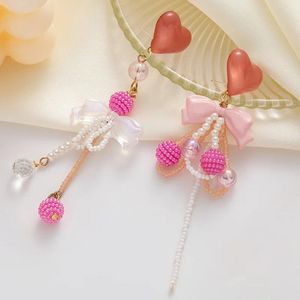 Boucles d'oreilles pendantes en forme de cœur rose doux, perle exquise, nœud papillon, mode, longs glands asymétriques, bijoux pour femmes et filles, 2024