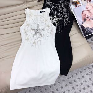 Designer dress for women with a sense of luxury and temperament. Five pointed star water diamond chain studded bead sleeveless dress looks slimming