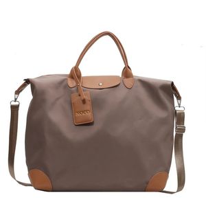 Sacola de grande capacidade para feriados bolsa de viagem feminina duffle bolsa de nylon grande bolsa de fim de semana bagagem bolsa de noite bolso 240103