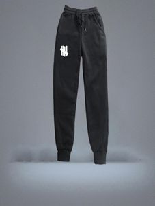 Nowe spodnie dresowe Men039S Hip Hop Streetwear Spodnie Modne mężczyźni niepokonana chłodna wysokiej jakości spodnie polar