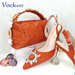 Spezielles Design, hochwertiges orangefarbenes afrikanisches Frauen-Schuh- und Taschen-Set mit glänzendem Kristall für die Hochzeitsfeier 240106