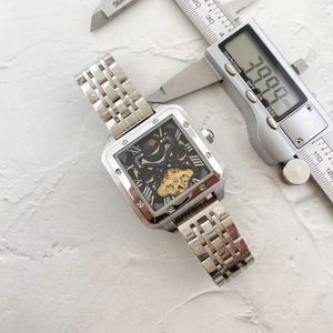 女性の時計デザイナーは、エレガントでスタイリッシュな男性と女性の時計スキンストラップ自動機械運動フライホイールメンズウォッチ