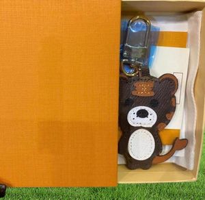 Брелки для ключей с изображением льва, тигра, обезьяны и медведя, роскошный дизайнерский кожаный брелок для ключей с лазерным тиснением, подвески для сумок с коробкой 18533044595
