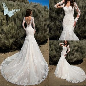 Abiti da sposa a sirena di lusso a maniche lunghe Abiti da sposa in tulle con applicazioni di pizzo Vedi attraverso i bottoni Abiti da sposa posteriori Robe De Mariee