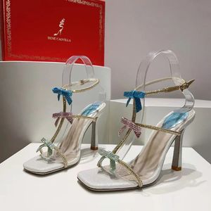 Rene Caovilla Bowtie Rhinestone Sandals 발목 T 묶인 가죽 아웃솔 스틸 레토 펌프 여성 파티 이브닝 ​​드레스 신발 고급 디자이너 하이힐 공장 신발 00