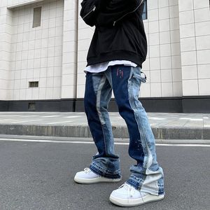 Vintage angustiado respingo tinta flare jeans homens streetwear retalhos hip hop graffiti lavagem pesada azul fino ajuste calças jeans homens 240108