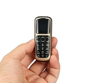Ny minsta bar mobiltelefoner Original V2 Intelligent Magic Voice GSM Bluetooth Dial Mini Backup Pocket Portable Mobiltelefon för K7250305