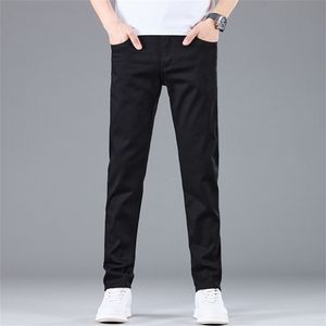 Men's jeans summer light luxury high-end leather brand metal button pocket zipper design long pants fashionable elastic straight leg pants for teenagers