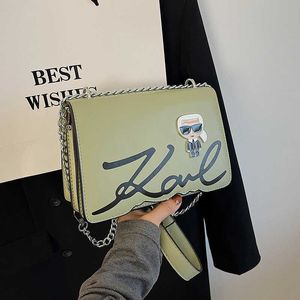 Nuovo stile alla moda Karl Lagerfield Women Occiglia Stuffa versatile Lettere Squama quadrata a catena Croce Designer Borse carine borse