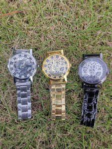 Relógios masculinos de venda quente universal grande escavado banda de aço high-end imitação design mecânico estudante exame quartzo