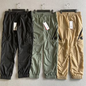 Pantaloni da uomo in nylon metallico Una tasca con cerniera con logo per lenti Pantaloni da tuta tinti in capo cromati-R maschili Tuta da esterno Pantaloni da jogging CP casual