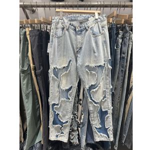 Verkliga bilder nödställda jeans mäns blå modebyxor hip-hop gata hål denim byxor