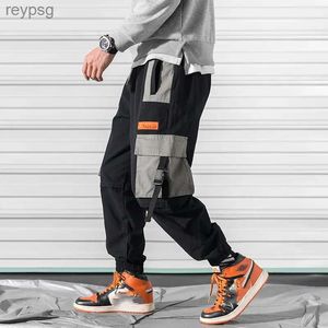 Calças masculinas calças de retalhos de bolso grande roupas de rua calças defensoras Harajuku roupas de trabalho soltas hip-hop FJCasial calças de trilha 2023 YQ240115