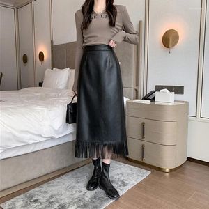 Spódnice Ohryiyie Black Fashion Tassels Faux skórzana spódnica Kobiety jesienne zima długą wysoką talię A-line lini elegancka pu kobieta